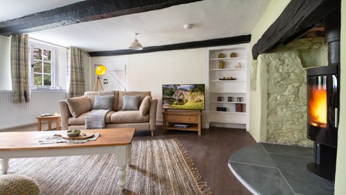The open-plan kitchen, sitting and dining room at Riverside Cottage, Devon